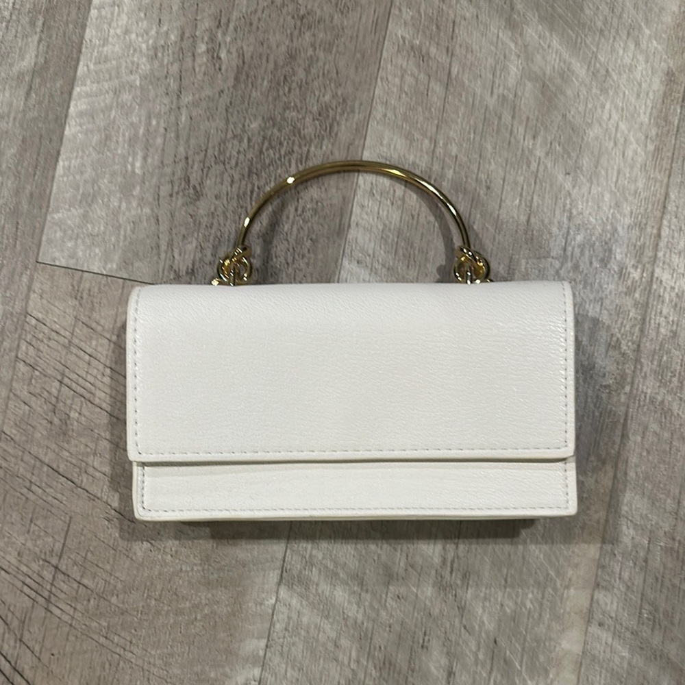 Elegant White Handbag with Gold Accents